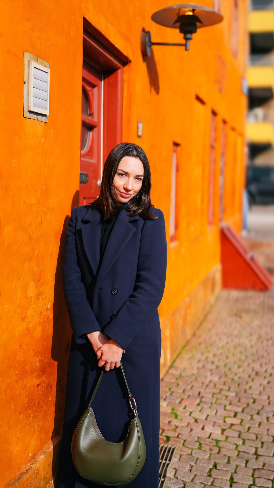 Wedding photographer Copenhagen — bride backlit by golden hour sunlight